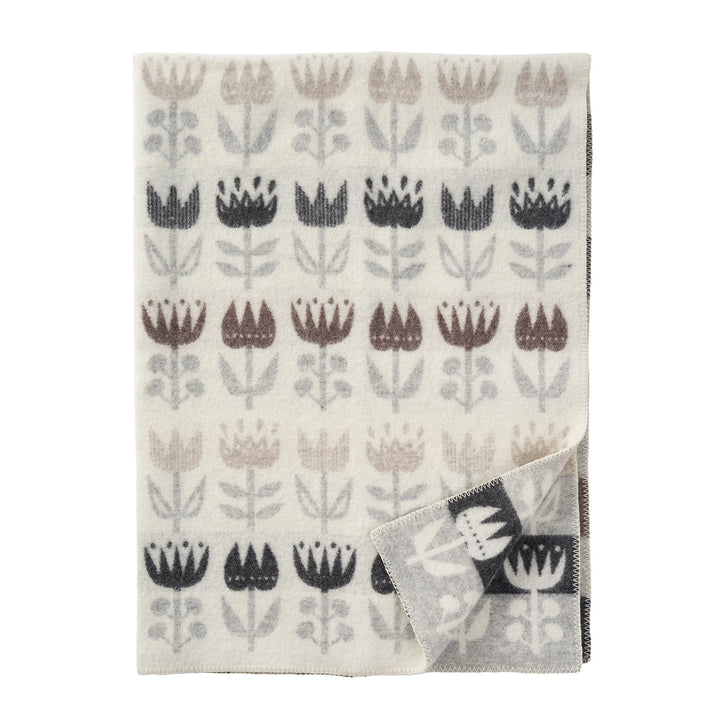 Manta Tulip gris de Klippan, con tulipanes